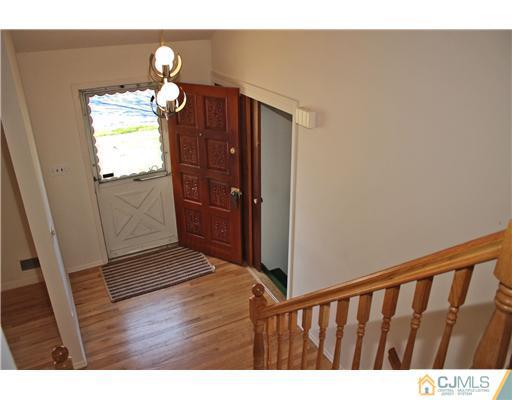 19 Timber Road Edison, NJ 08820 - Photo 13 of 25 a balcony with wooden floor