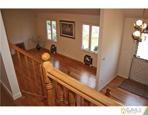 19 Timber Road Edison, NJ 08820 - Photo 14 of 25 a view of a hardwood floor and wardrobe