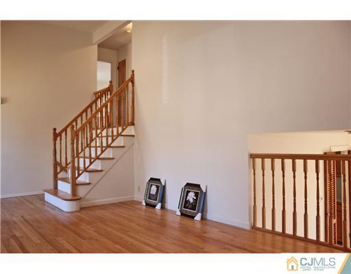 19 Timber Road Edison, NJ 08820 - Photo 15 of 25 a view of a hallway with wooden floor