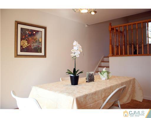 19 Timber Road Edison, NJ 08820 - Photo 17 of 25 a bedroom with a bed and a chandelier