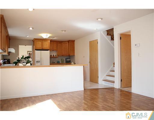 19 Timber Road Edison, NJ 08820 - Photo 21 of 25 a view of kitchen with refrigerator and wooden floor