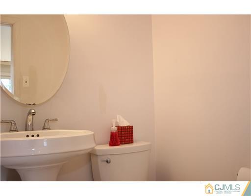 19 Timber Road Edison, NJ 08820 - Photo 24 of 25 a bathroom with a sink and a mirror