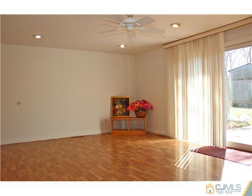 19 Timber Road Edison, NJ 08820 - Photo 5 of 25 a bedroom with a bed and a window
