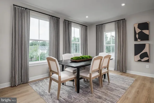 a dining room with furniture window wooden floor