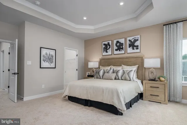 a bedroom with a bed and a night stand