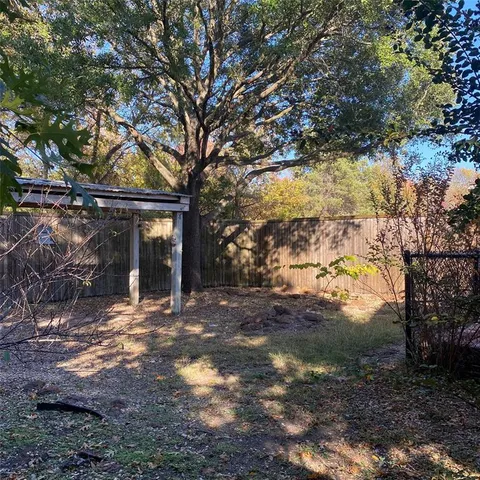 a view of a house with a yard tree s