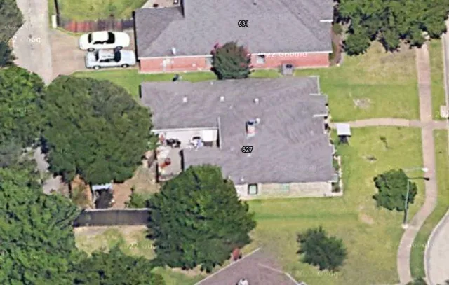 an aerial view of a house with a garden