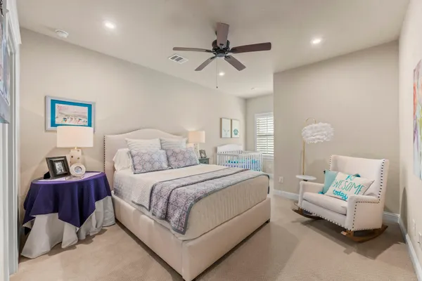 a bedroom with a bed and window