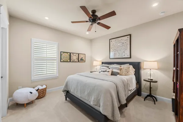 a bed room with a bed and a desk