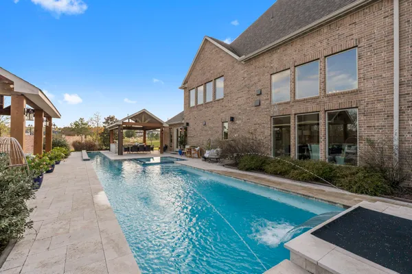 a view of a patio with swimming pool