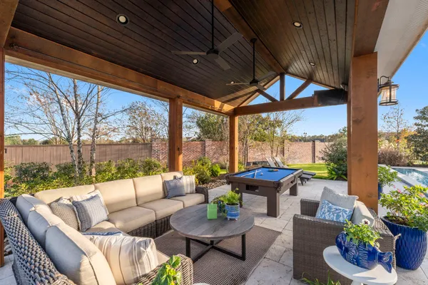 a view of a house with a yard porch and furniture