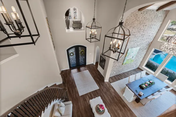 a living room with chairs and a table