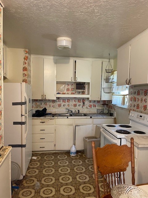 3530 Carrolleton Street Corpus Christi, TX 78411 - Photo 3 of 16 a kitchen with stainless steel appliances granite countertop a sink stove and refrigerator