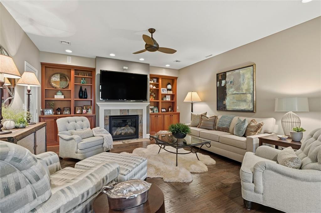 4502 Senate Court Valencia, PA 16059 - Photo 25 of 49 a living room with furniture a fireplace and a flat screen tv