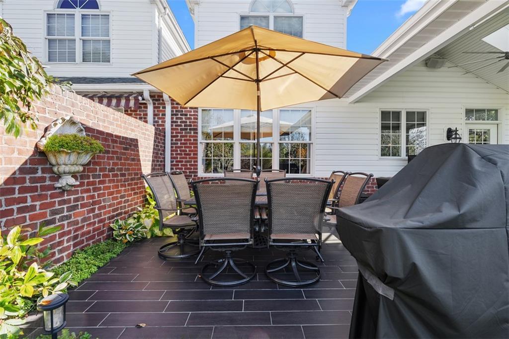 4502 Senate Court Valencia, PA 16059 - Photo 45 of 49 a view of a patio with table and chairs under an umbrella