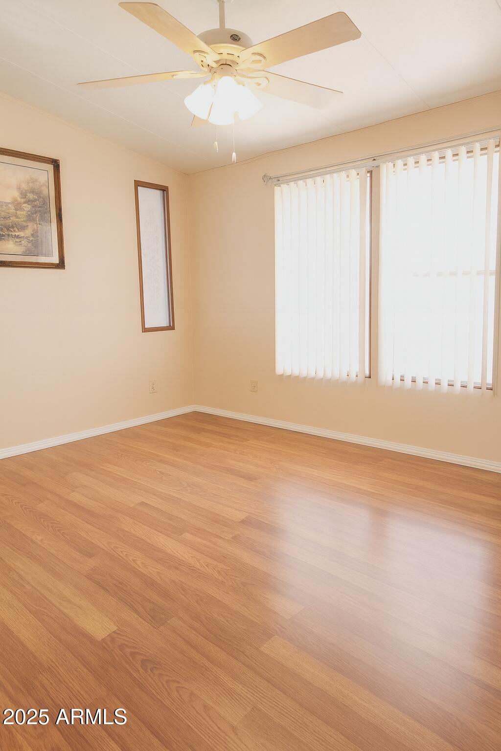 8600 East Broadway Road, Unit 55 Mesa, AZ 85208 - Photo 7 of 14 wooden floor in an empty room with a window