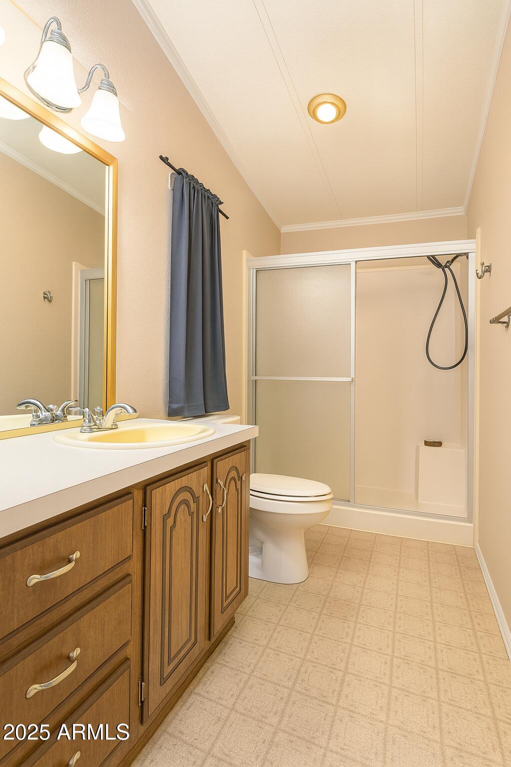 8600 East Broadway Road, Unit 55 Mesa, AZ 85208 - Photo 8 of 14 a bathroom with a sink a toilet and shower