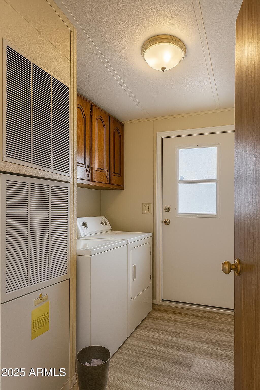 8600 East Broadway Road, Unit 55 Mesa, AZ 85208 - Photo 10 of 14 a view of a storage & utility room with washer and dryer