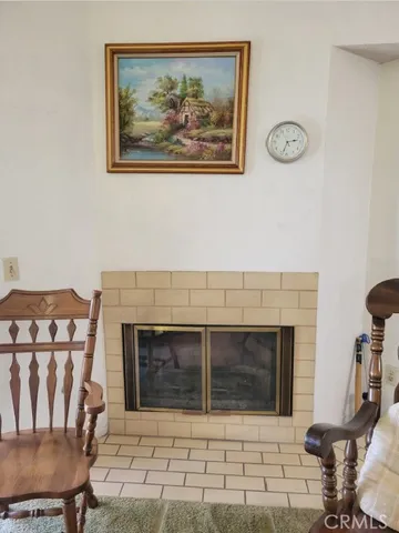 a living room with a fireplace and a table