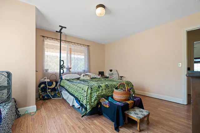 a bedroom with bed and a window