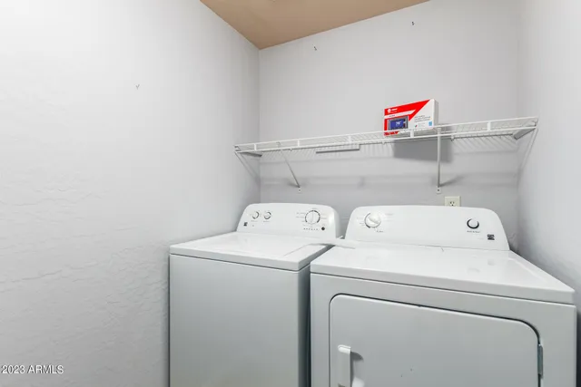 a spacious bedroom with a bed and a couch