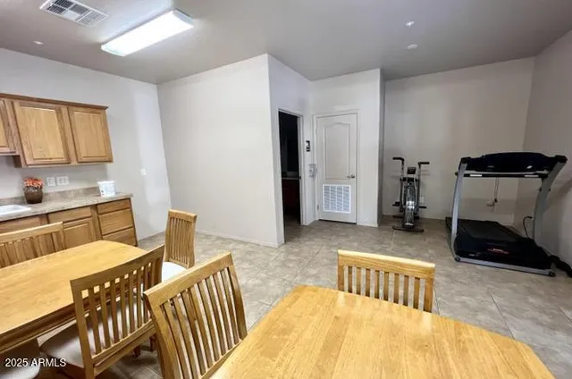 a view of a house with swimming pool and sitting area