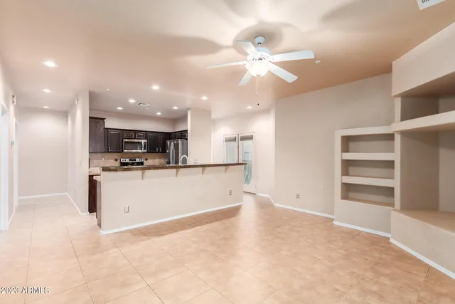a view of walk in closet with wooden floor