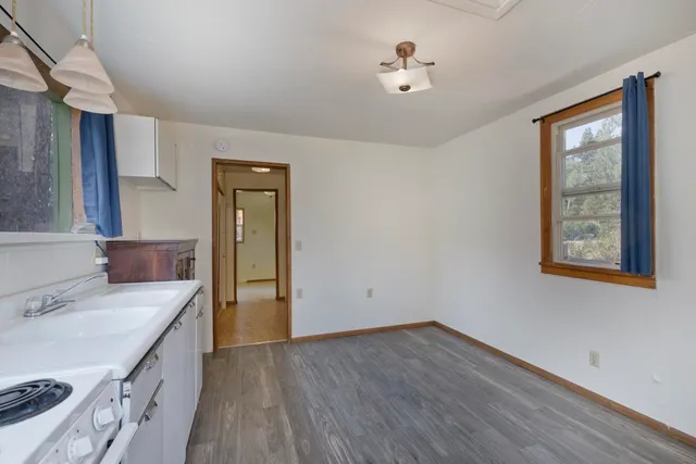 a room with a sink and a window