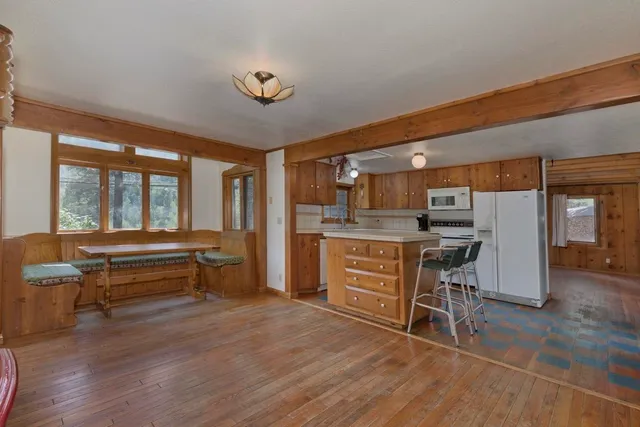 a outdoor space with a large window and furniture