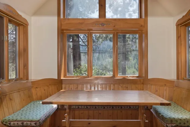 a view of a room with a large window and couch
