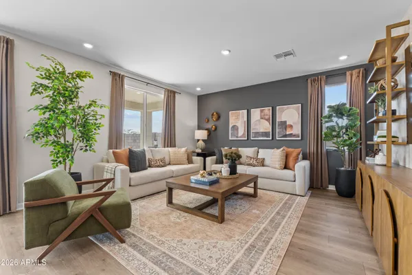 a living room with furniture and a large window