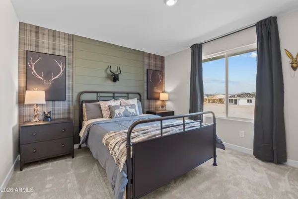 a bed room with bed and window