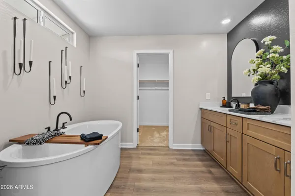 a bathroom with a sink a faucet and a mirror