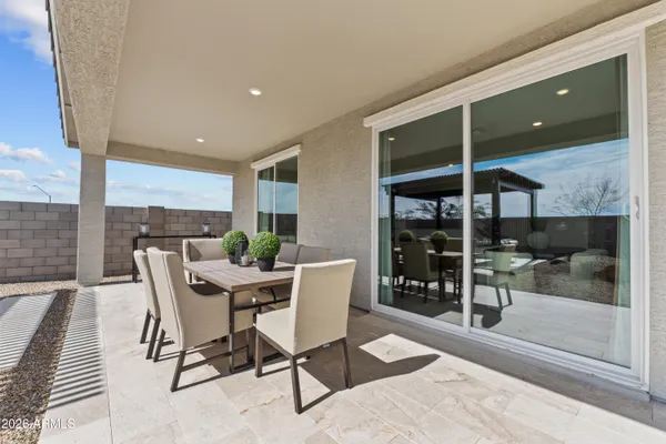 a dining room with furniture and window