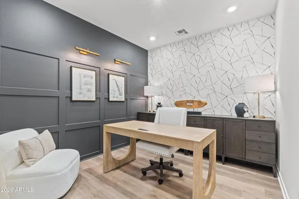 a workspace with furniture and window