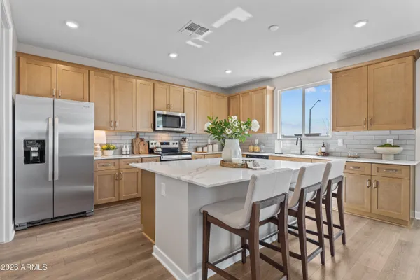 a kitchen with counter top space cabinets and stainless steel appliances