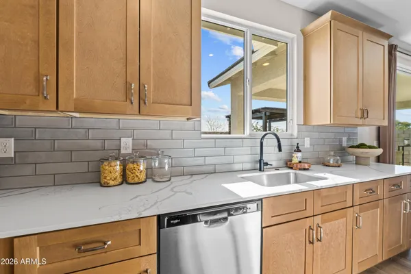 a kitchen with a sink and cabinets
