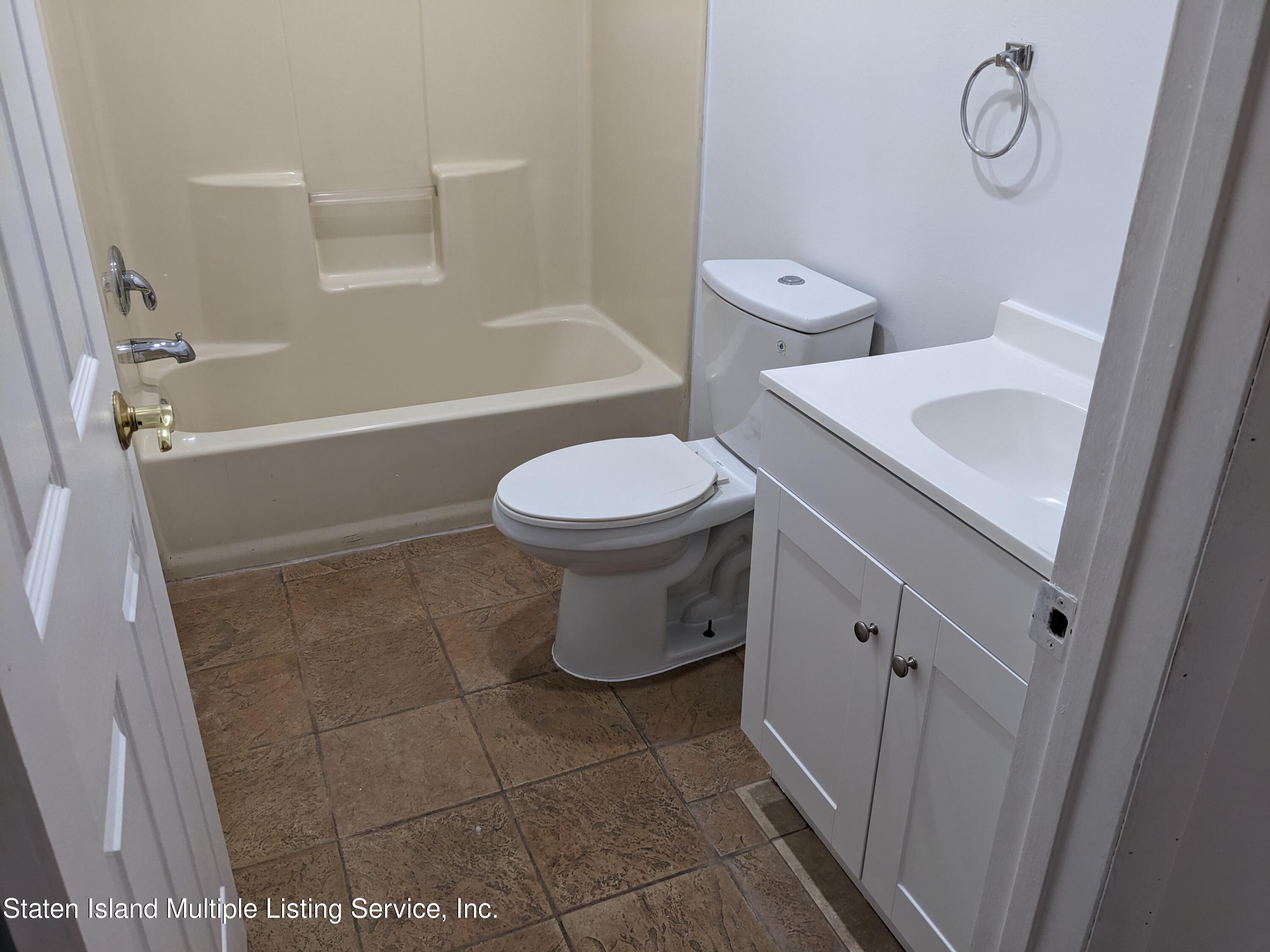 7609 Sawmill Road Pocono Lake, PA 18347 - Photo 15 of 47 a bathroom with a toilet a sink and a shower