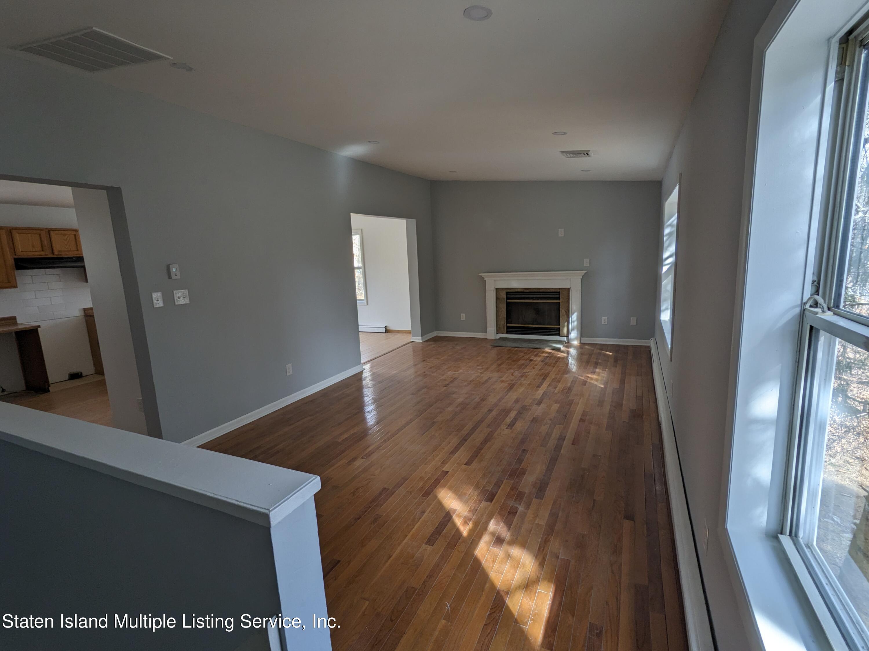 7609 Sawmill Road Pocono Lake, PA 18347 - Photo 17 of 47 a view of a livingroom with wooden floor