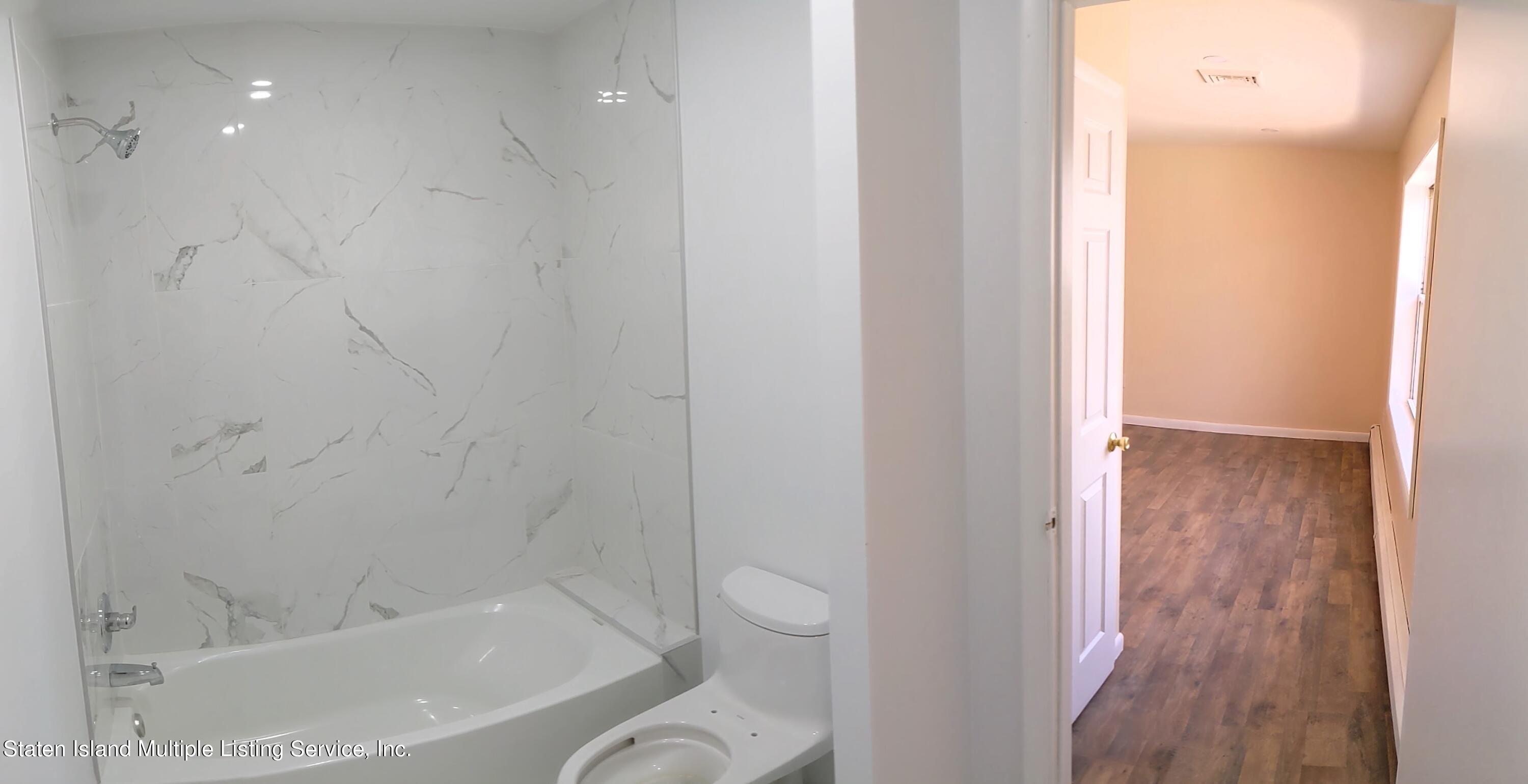 7609 Sawmill Road Pocono Lake, PA 18347 - Photo 27 of 47 a bathroom with a bathtub and a shower