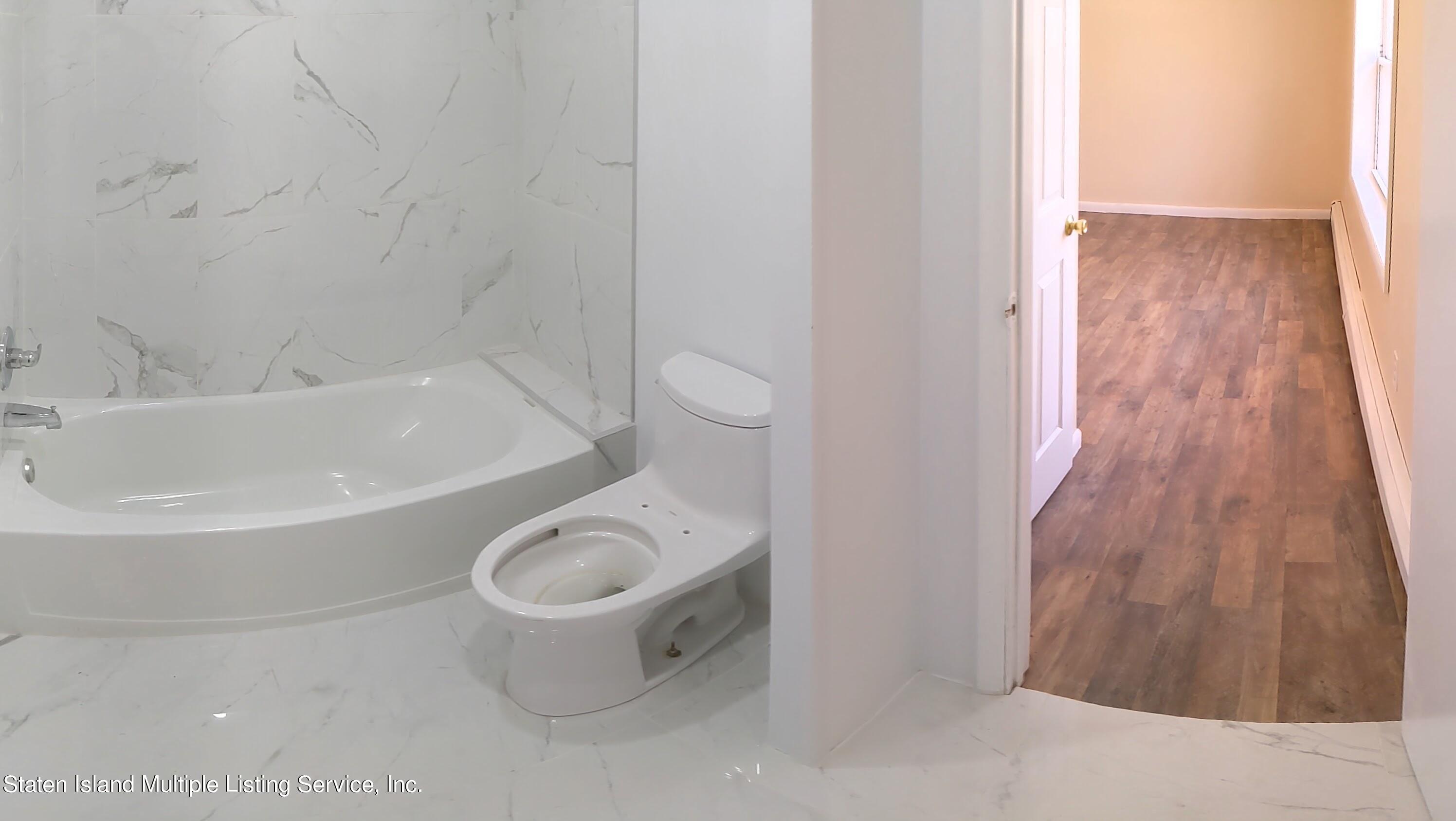 7609 Sawmill Road Pocono Lake, PA 18347 - Photo 28 of 47 a bathroom with a toilet and a bathtub