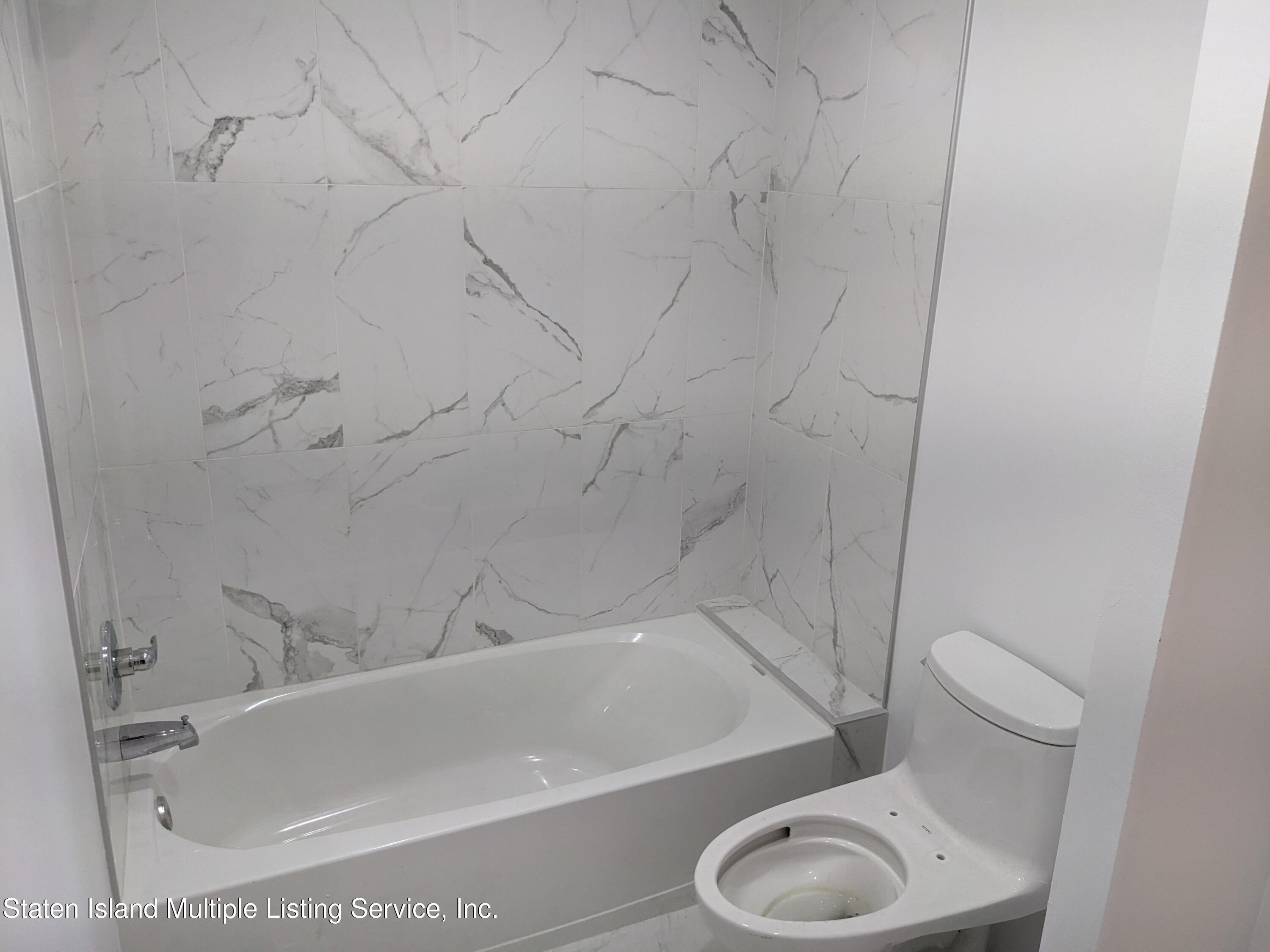 7609 Sawmill Road Pocono Lake, PA 18347 - Photo 29 of 47 a bathroom with a toilet and a bathtub