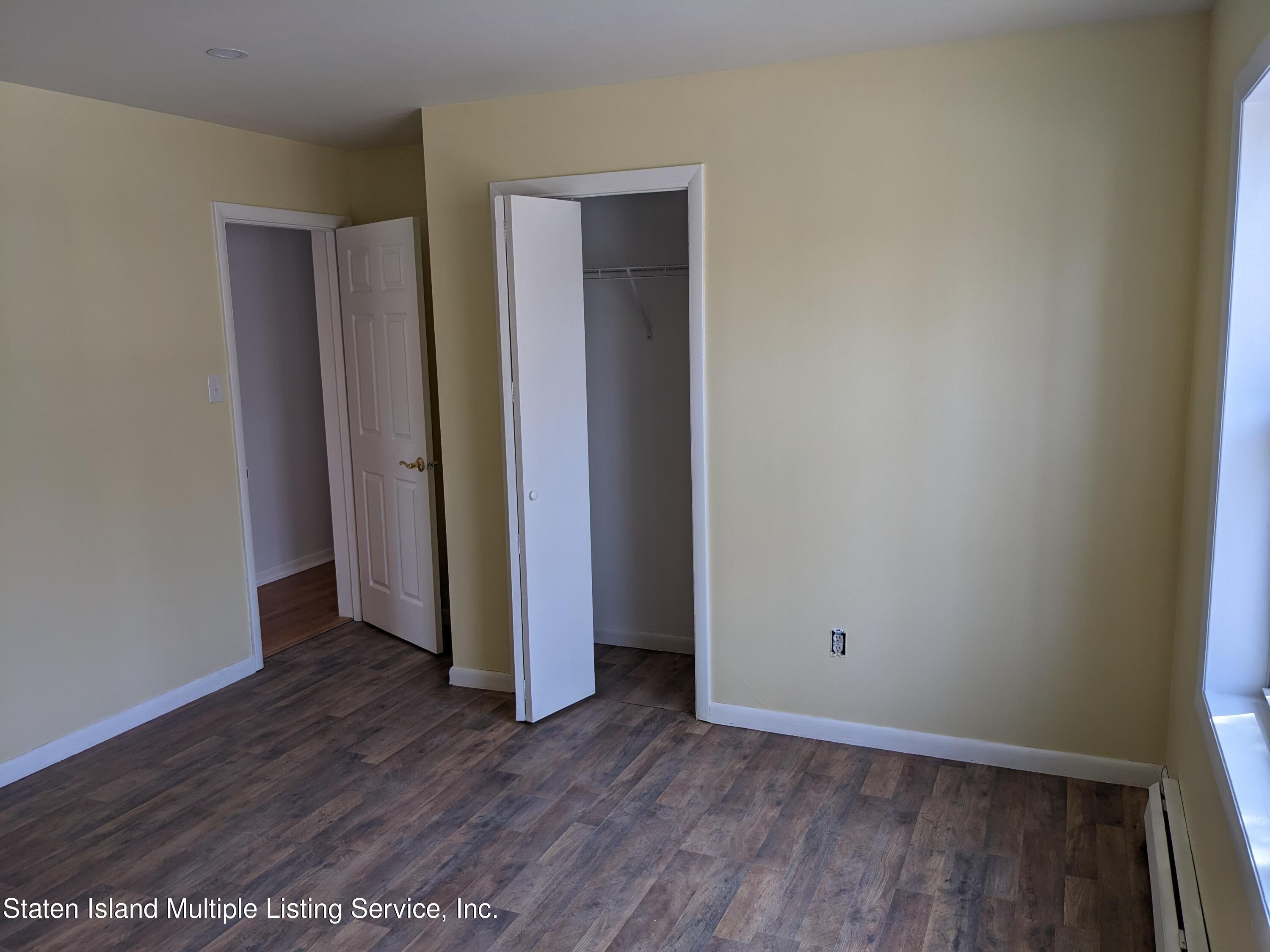 7609 Sawmill Road Pocono Lake, PA 18347 - Photo 33 of 47 a view of an empty room with wooden floor