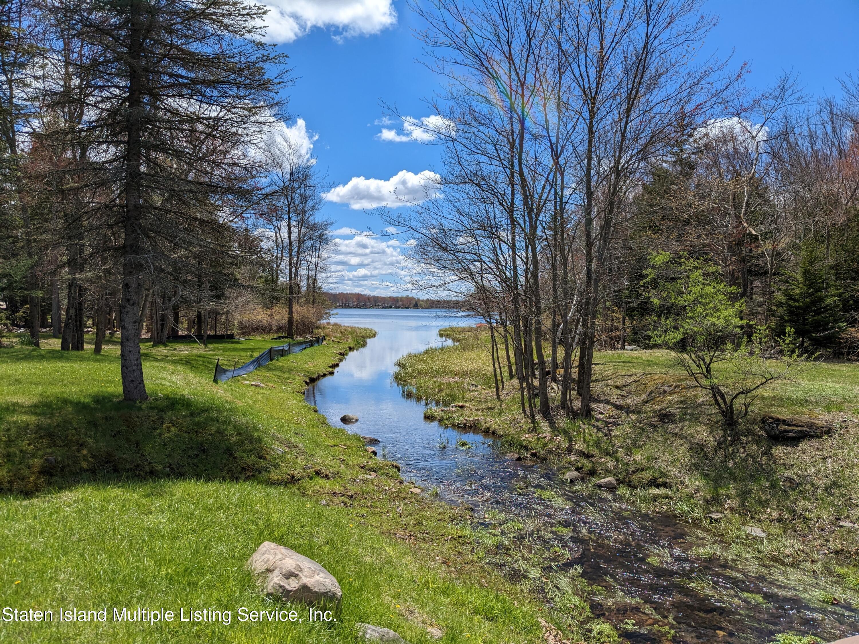 7609 Sawmill Road Pocono Lake, PA 18347 - Photo 35 of 47 a view of backyard with tree