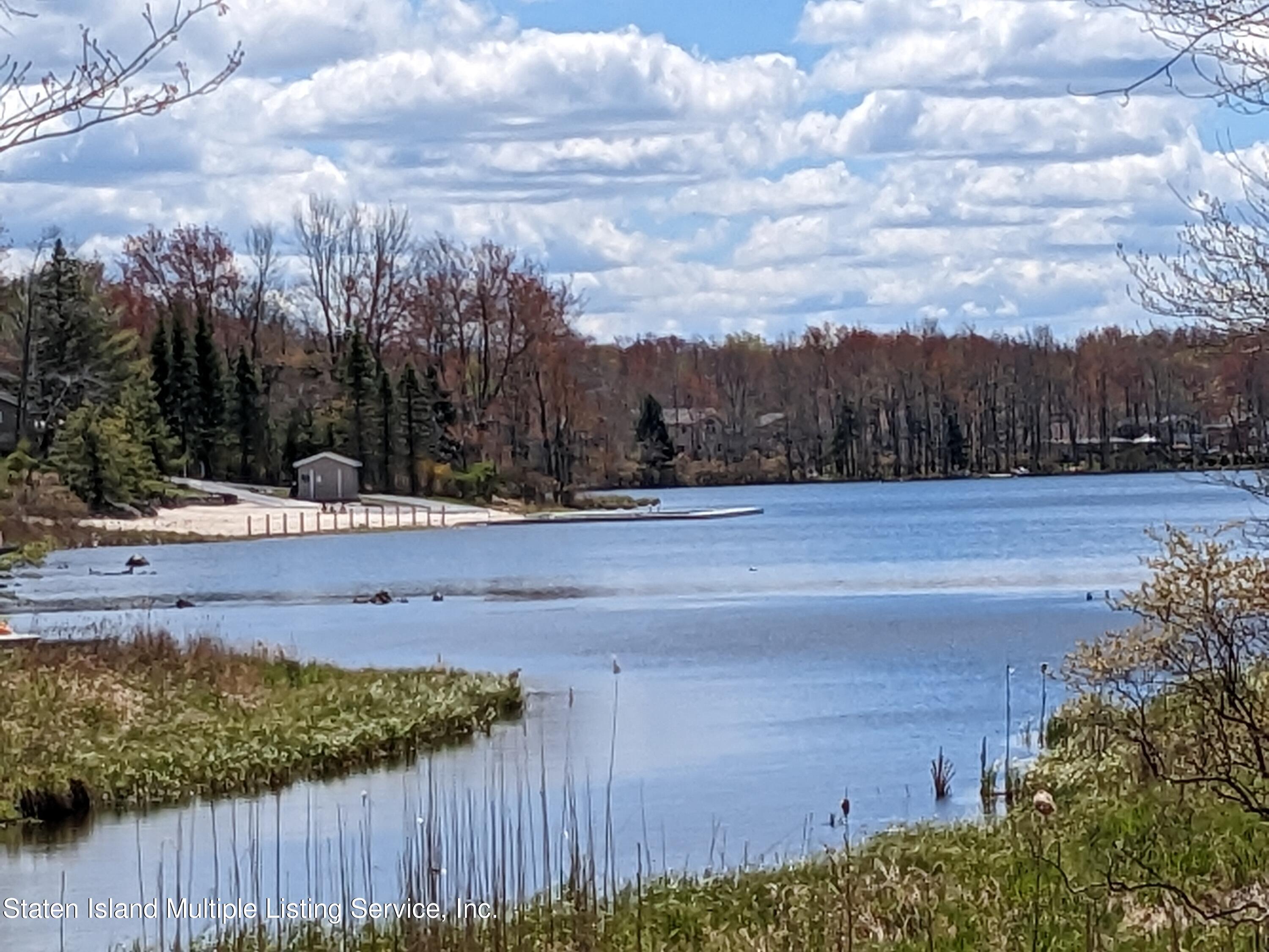 7609 Sawmill Road Pocono Lake, PA 18347 - Photo 36 of 47 a view of a yard with an outdoor seating