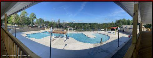 7609 Sawmill Road Pocono Lake, PA 18347 - Photo 40 of 47 a view of a swimming pool with a patio