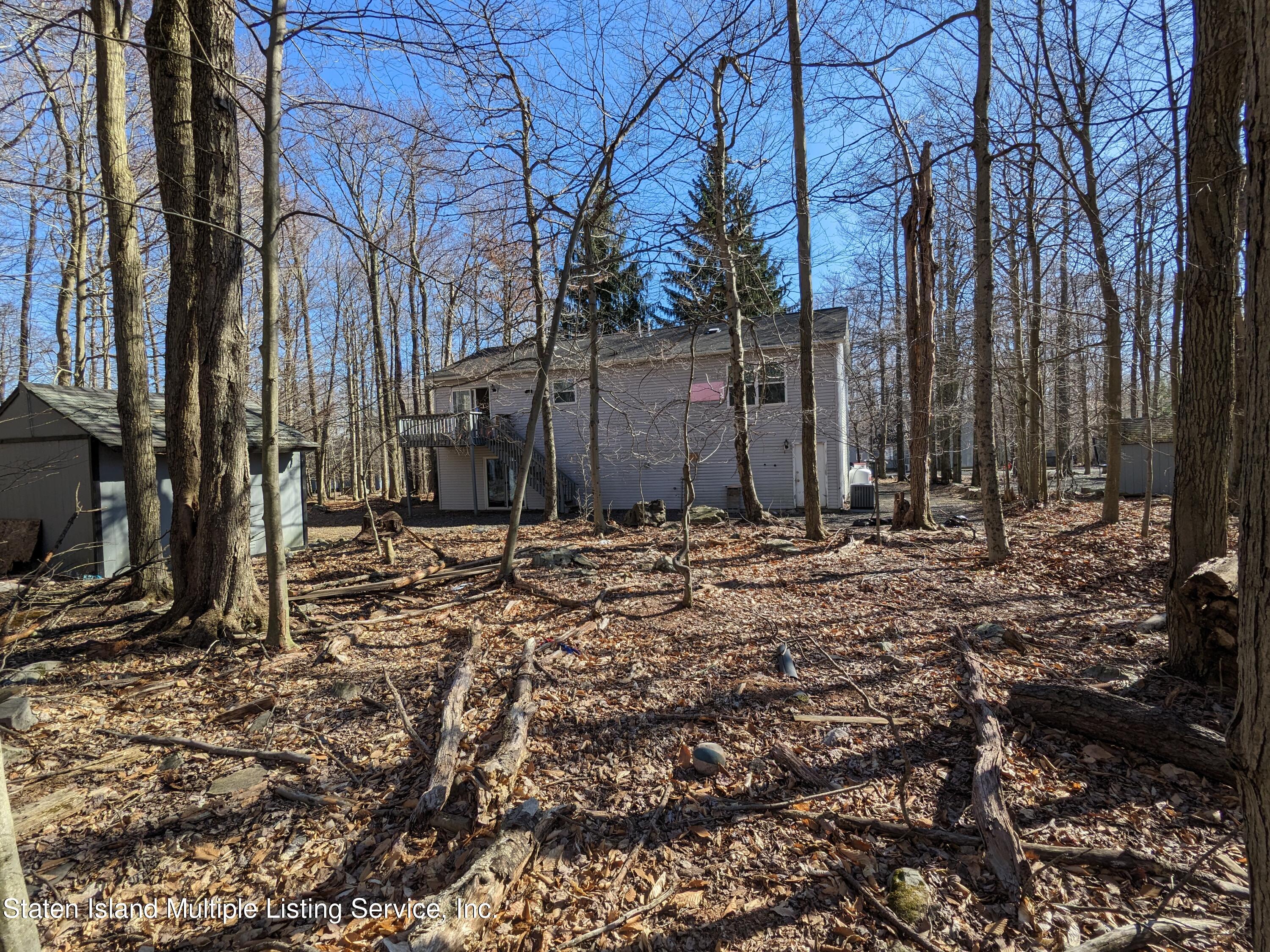 7609 Sawmill Road Pocono Lake, PA 18347 - Photo 5 of 47 a view of a backyard of the house