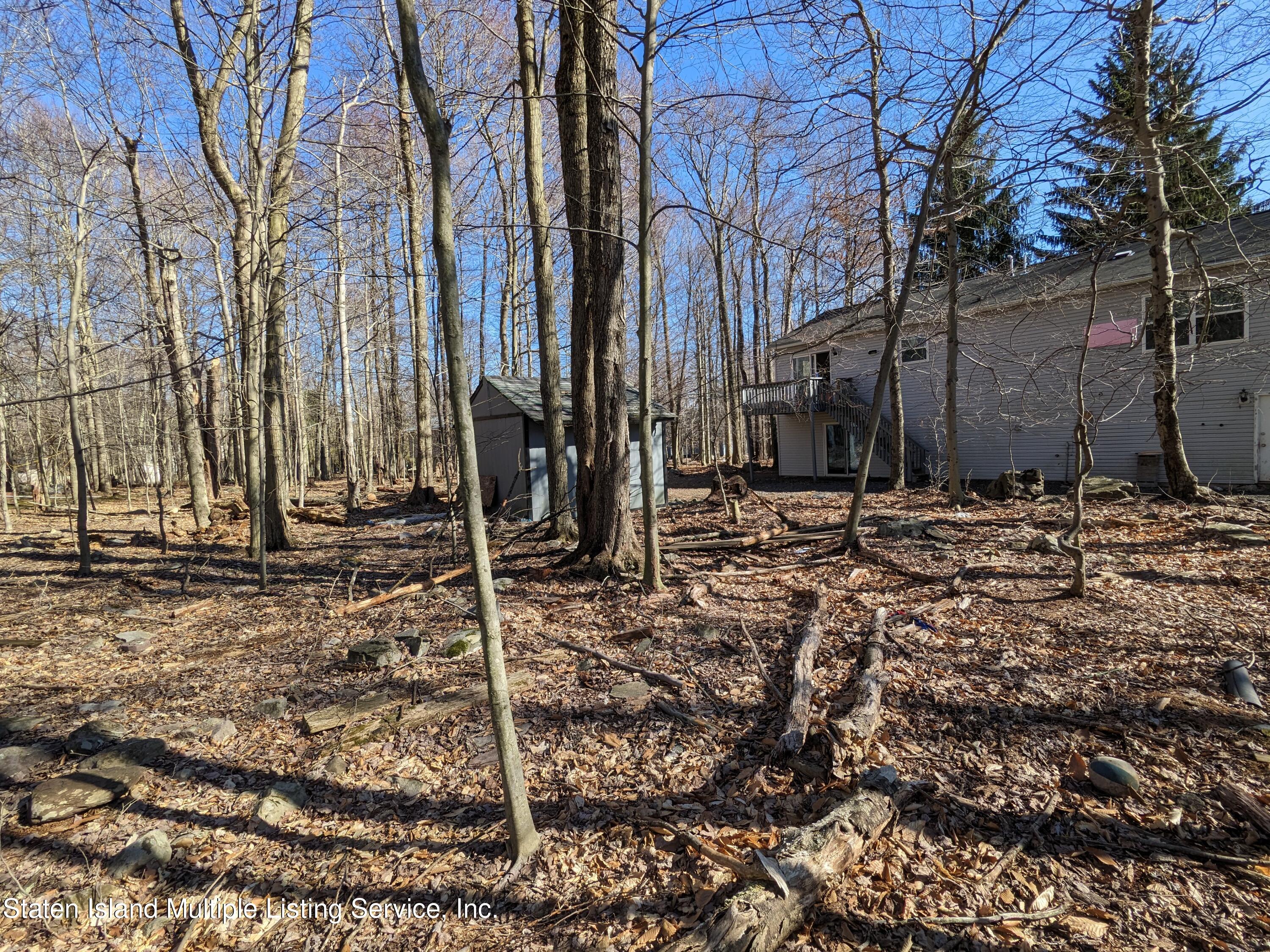 7609 Sawmill Road Pocono Lake, PA 18347 - Photo 6 of 47 a backyard of a house with lots of green space