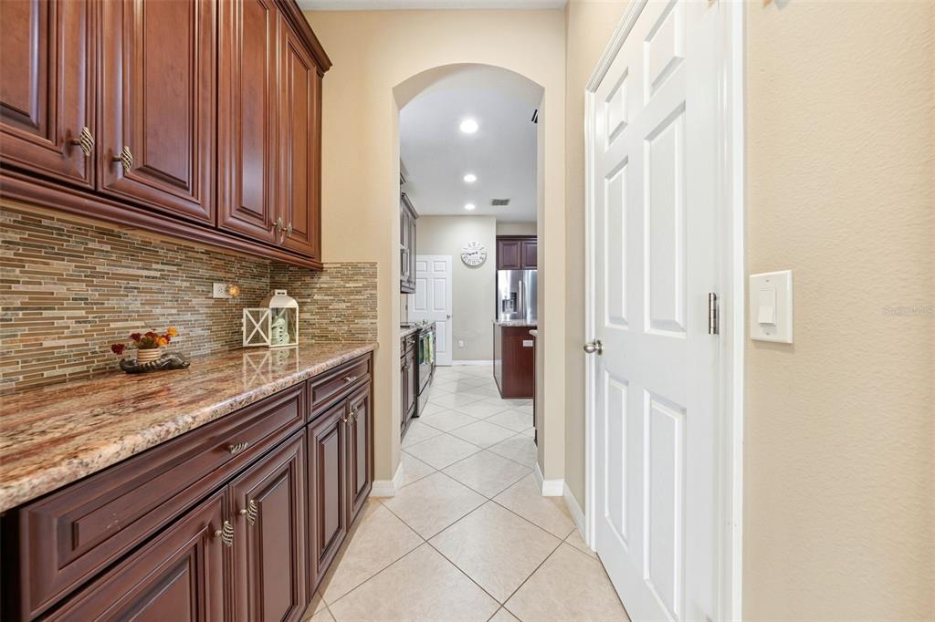 979 Counts Crest Circle Apopka, FL 32712 - Photo 12 of 48 a kitchen with stainless steel appliances granite countertop a sink and cabinets
