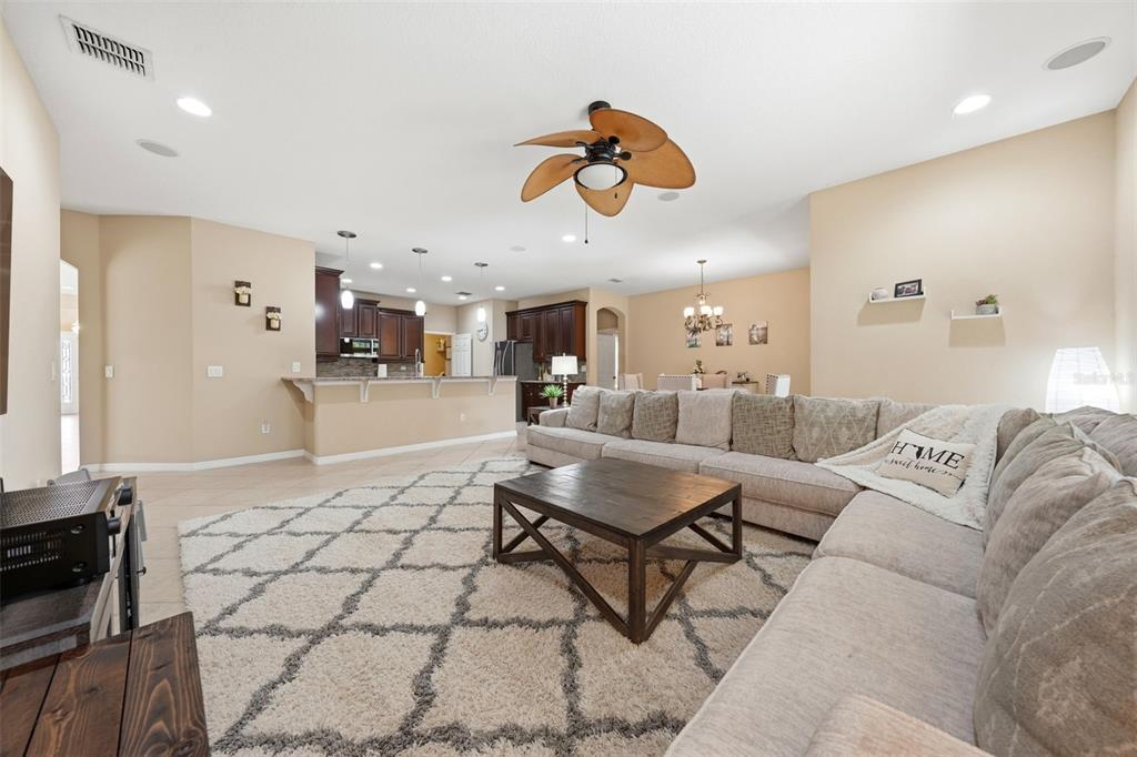 979 Counts Crest Circle Apopka, FL 32712 - Photo 16 of 48 a living room with furniture and kitchen view